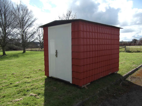 TempStor made of red uPVC, located in our Garden. The TempStor shows a double door which gives an opening width of 1050mm